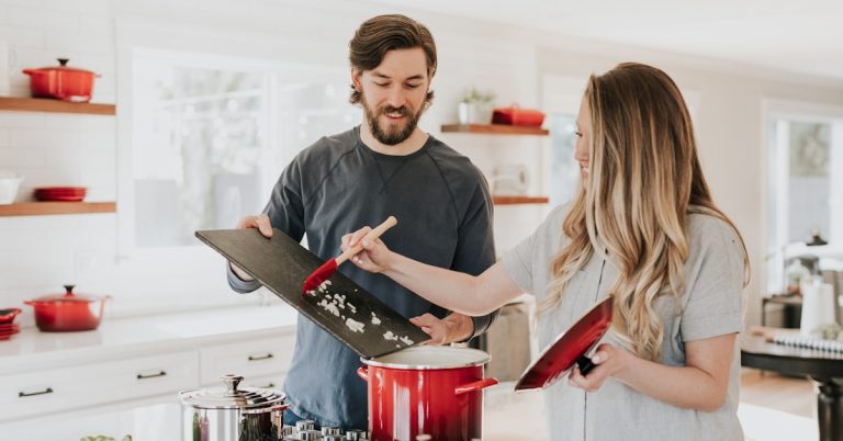 Family in kitchen managing household budget on low income