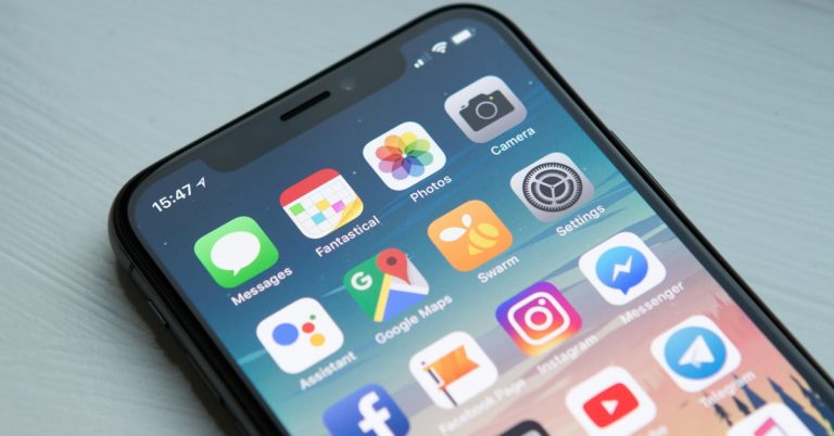 Person using a budgeting app on their smartphone