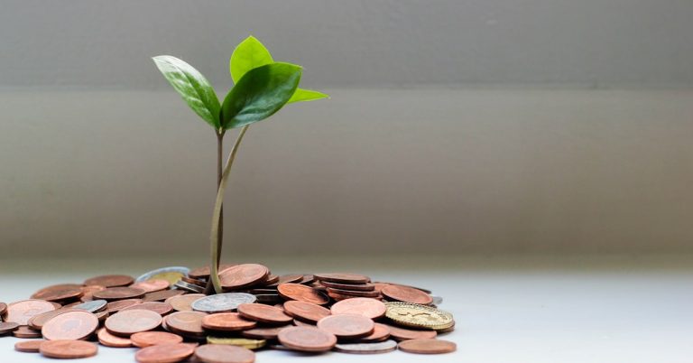 Coins and savings jar representing money saved with apps